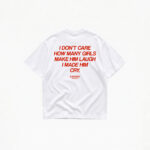 I DON'T CARE HOW MANY GIRLS MAKE HIM LAUGH T-SHIRT